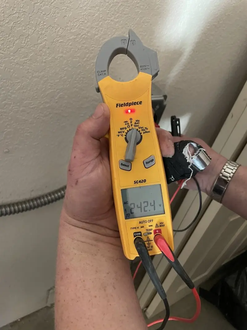 Voltage testing with clamp meter during Outlet Installation in Pomfret